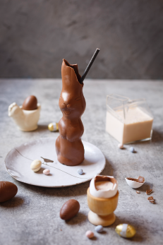 hollow chocolate Easter bunny with a straw through the top