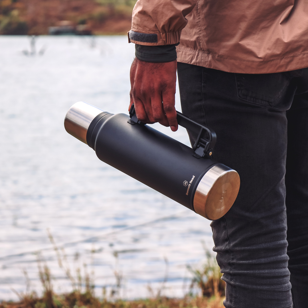 person holding vacuum flask